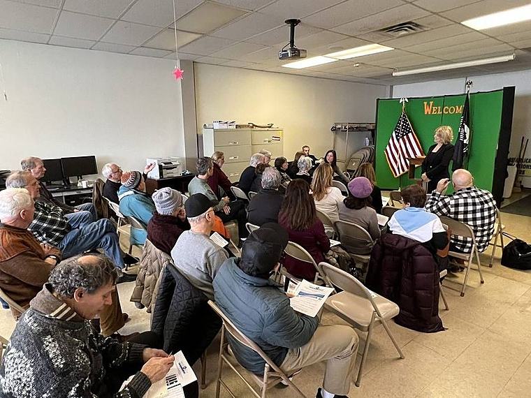 A ROWT member meeting with speakers and American flags