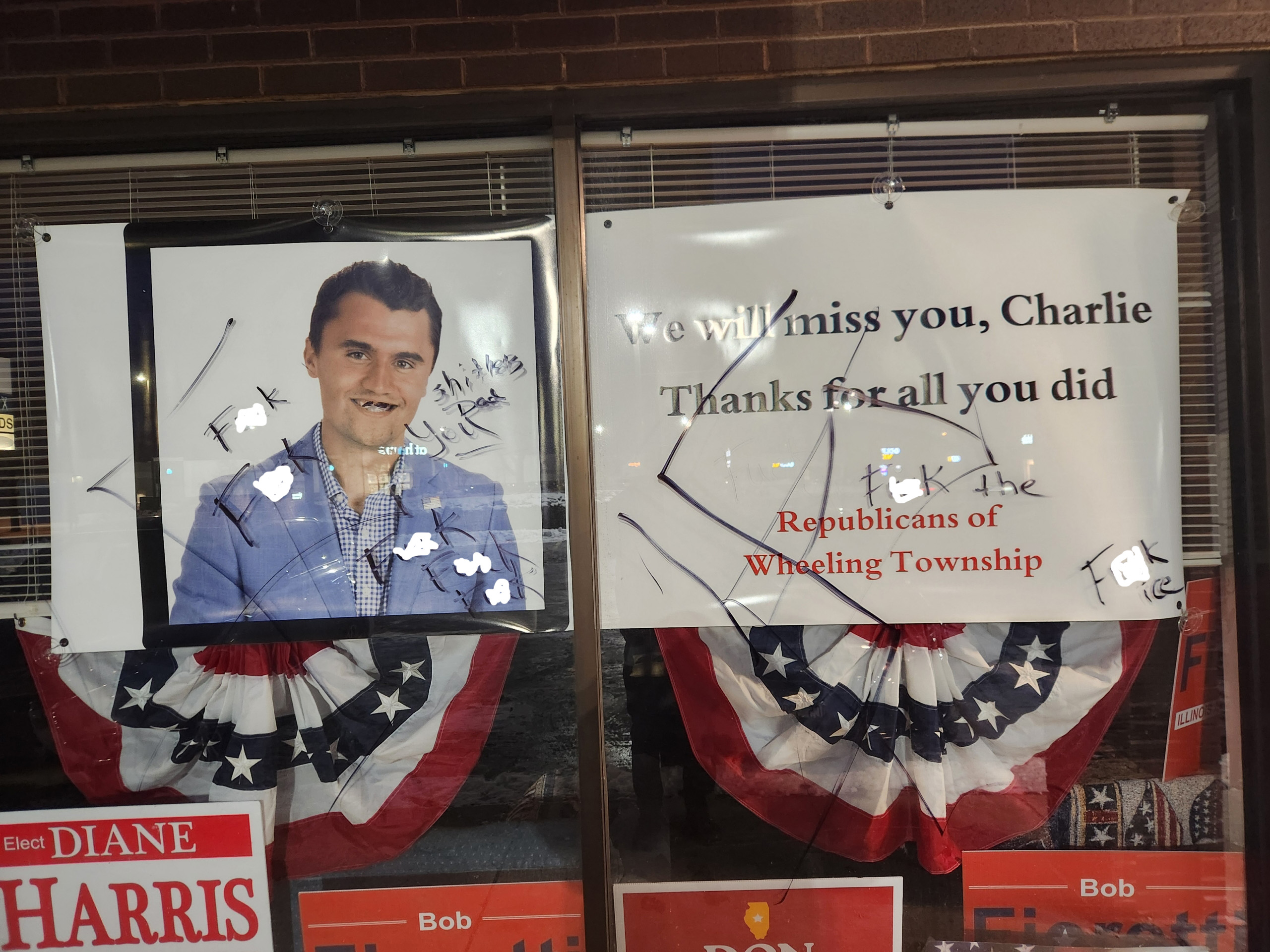 The ROWT office memorial to Charlie Kirk, defaced with profanity in the January 2026 vandalism incident; profanity has been obscured